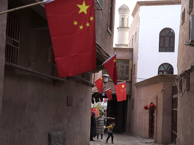 Chinese Muslims Shackled by Police State, High-Tech Surveillance